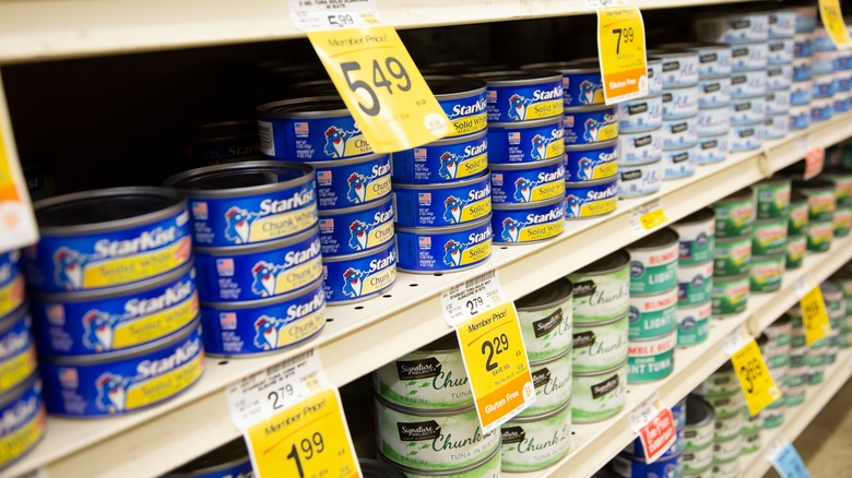 Cans of tuna on shelf 