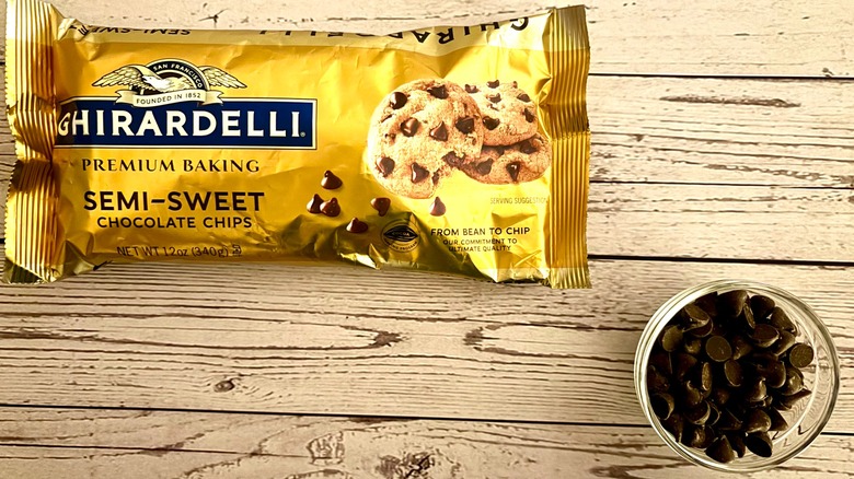 Ghirardelli Premium Baking Semi-Sweet Chocolate Chips packaging and chocolate chips in clear ramekin