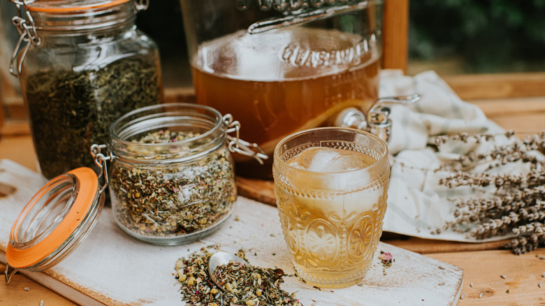 Loose leaf tea in a mason jar and a glass of iced tea