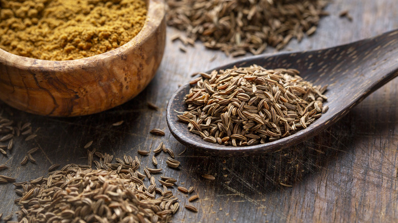 Caraway seeds in a wooden spoon