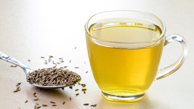 cumin tea in a glass mug