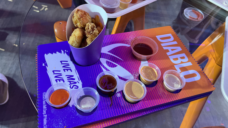 a tray of many dipping sauces