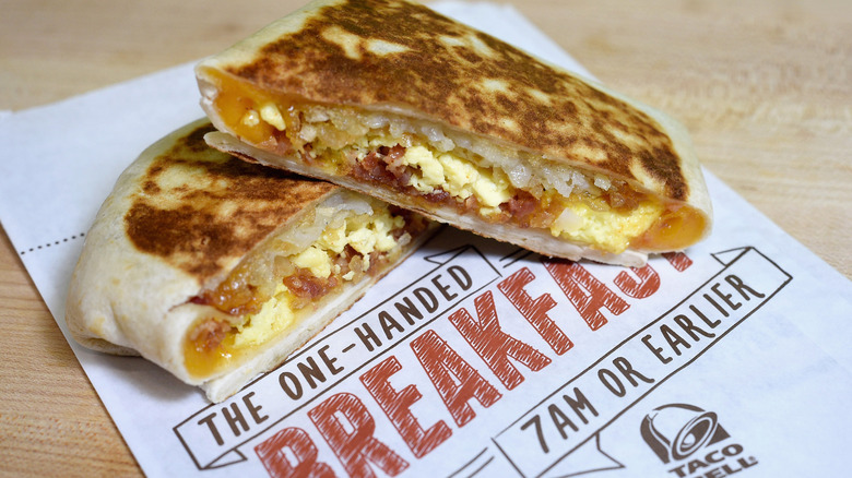 Taco Bell's Breakfast Crunchwrap is shown cut in half