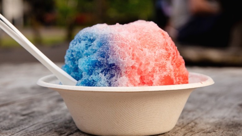 A close-up of red and blue Hawaiian shave ice.