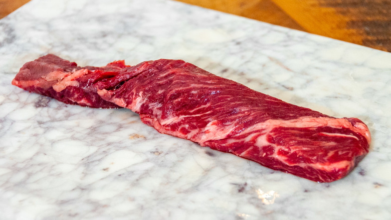 Raw hanger steak on a cutting board