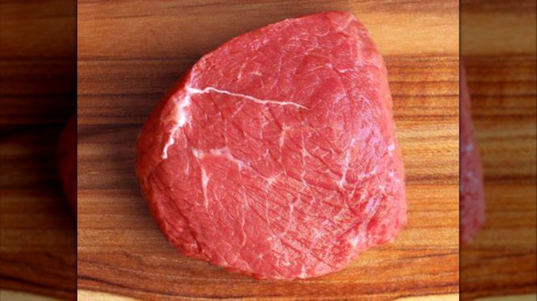 Raw top sirloin on cutting board