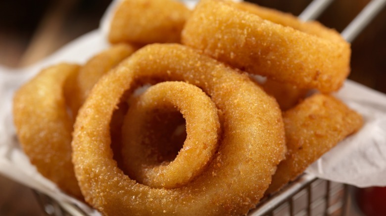 Golden onion rings in basket