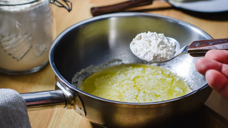 A person making roux.