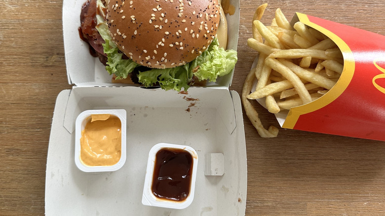 Two opened  McDonald's sauces for dipping