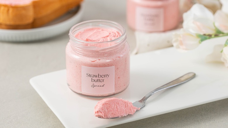 A jar of strawberry butter