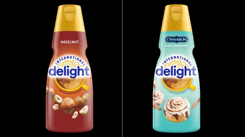 International Delight Cinnabon and hazelnut creamer bottles on black