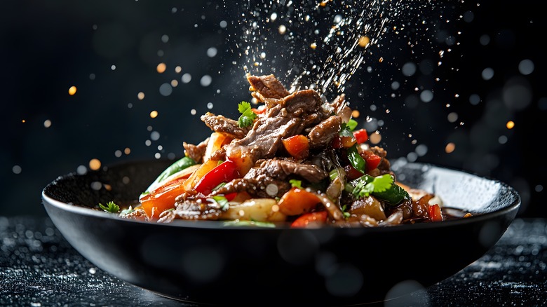 A bowl of lomo saltado, a classic Peruvian dish