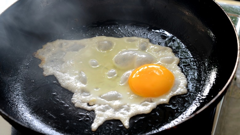 Egg frying in pan