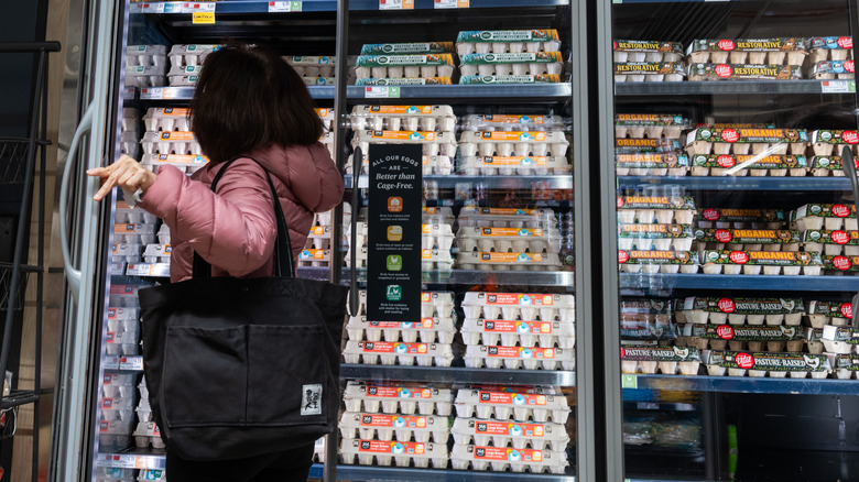 A person shops for eggs at Whole Foods