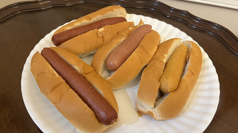 A plate of hot dogs is displayed.