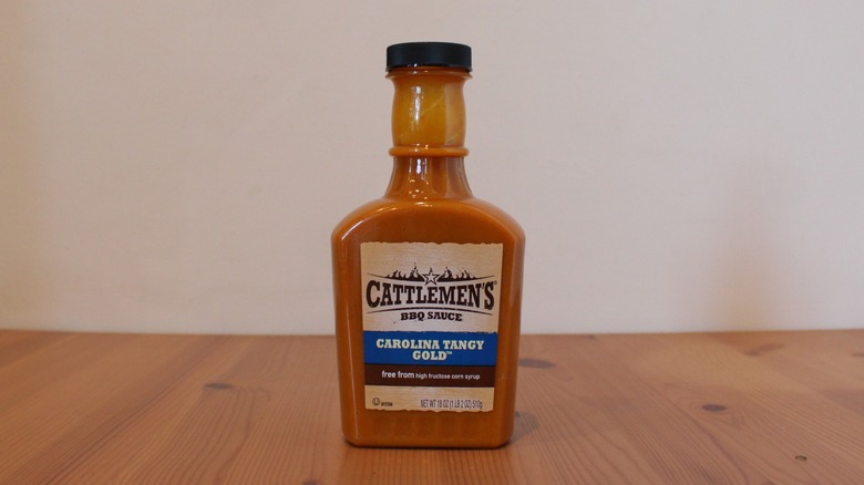 Cattlemen's Carolina Tangy Gold BBQ sauce on a wooden table