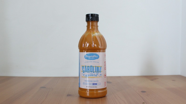 Sugarfire Carolina Mustard BBQ sauce on a wooden table