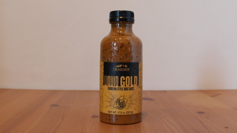 Traeger Liquid Gold Carolina-Style BBQ Sauce on a wooden table