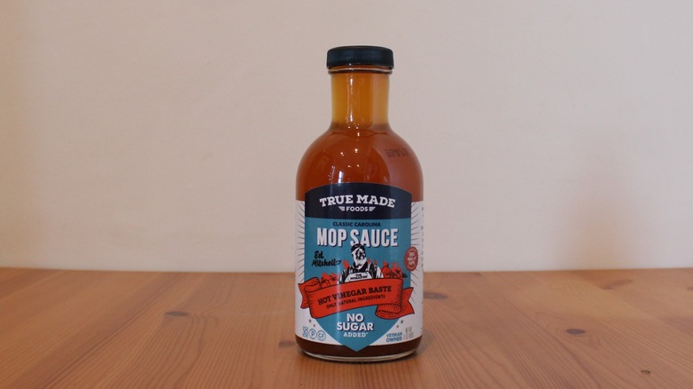 True Made Foods Classic Carolina Mop Sauce on a wooden table