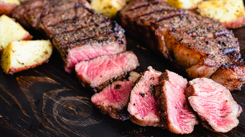 Grilled New York strip steak with roasted potatoes