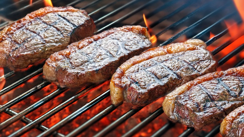 Top sirloin steaks on a hot grill