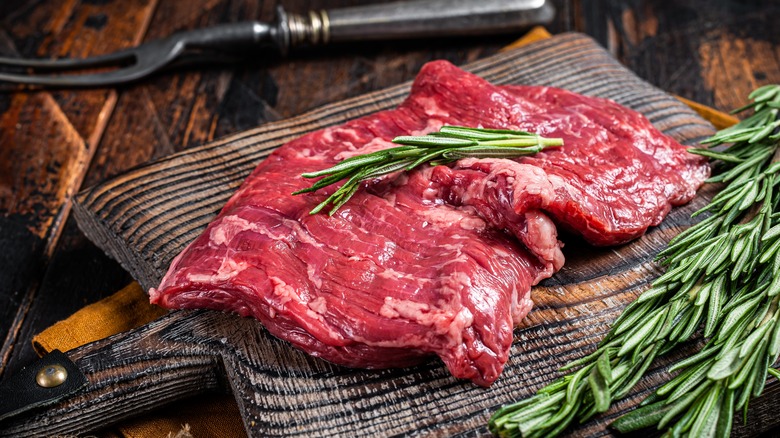 raw skirt steak on cutting board