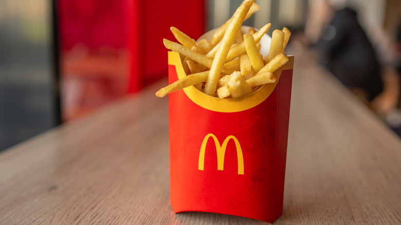 Container full of McDonald's fries on a restaurant counter