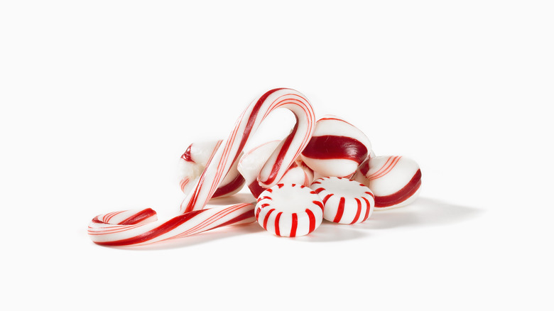 Candy canes and peppermint candies in a pile