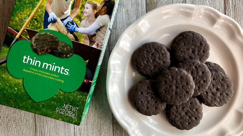 Box of Girl Scouts Thin Mints and cookies on a plate