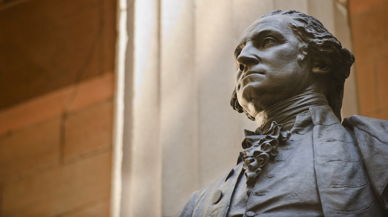 View from the shoulders up of a bronze statue of George Washington