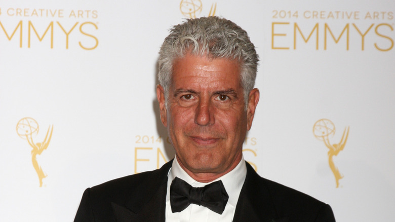 Anthony Bourdain posing on the red carpet.