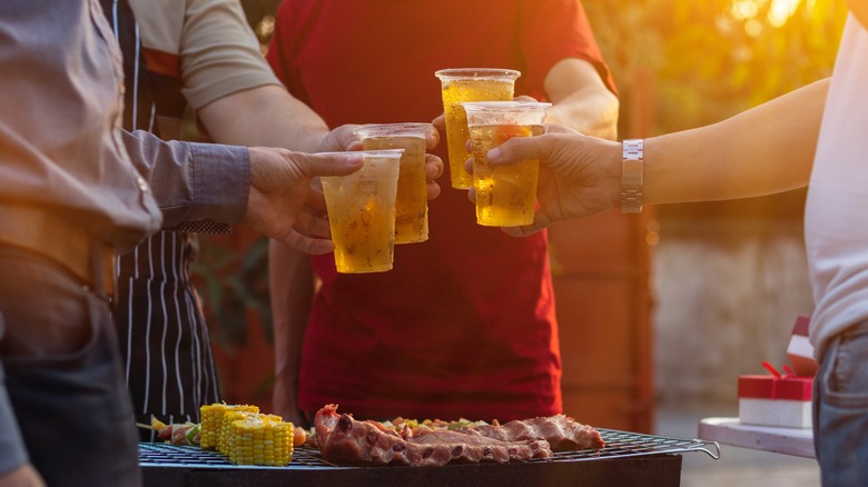 drinking beer at barbecue