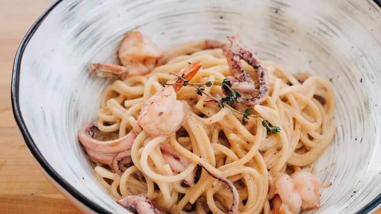 Seafood pasta dish with shrimp and octopus