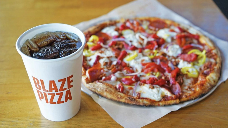 blaze pizza on table with drink cup