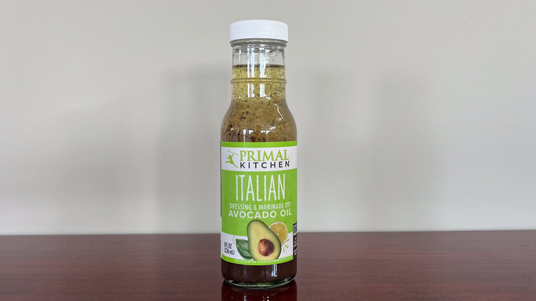 A bottle of Primal Kitchen Italian dressing