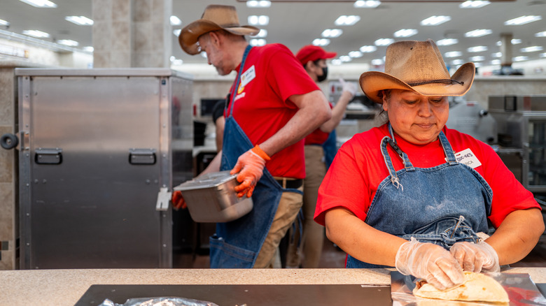 Buc-ee's worker rolling a burrito