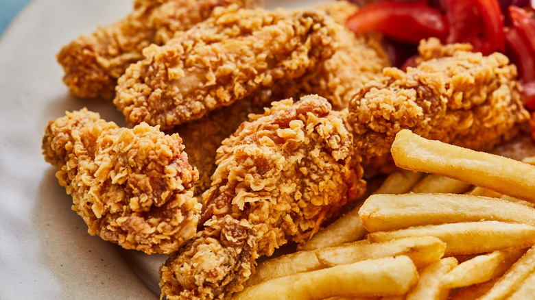 Fried chicken and french fries on a plate