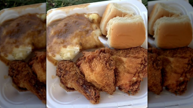 plate of fried chicken, mashed potatoes, and a roll