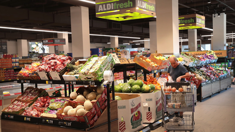 shoppers at Aldi buying groceries