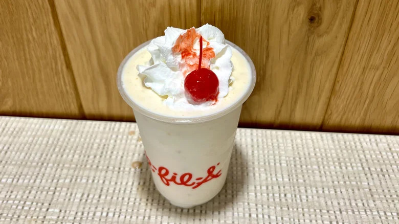 Chick-fil-A's Banana Pudding Milkshake with whipped cream and a cherry on top