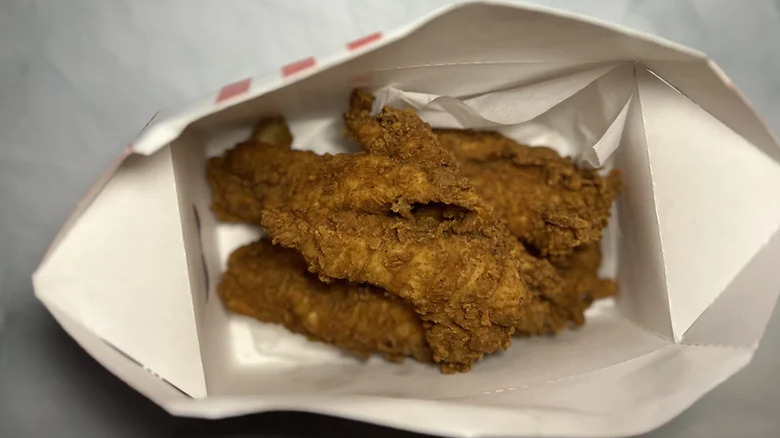 A box with several of KFC's Original Recipe Tenders