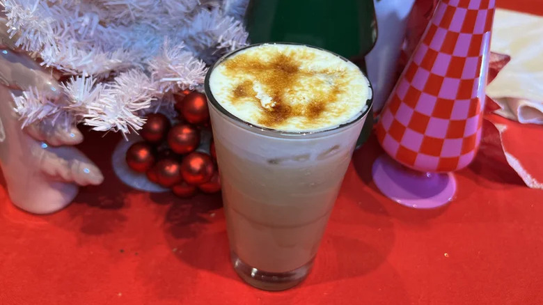 Starbucks Reserve's Iced Caramel Brûlée Eggnog Latte on a festive table