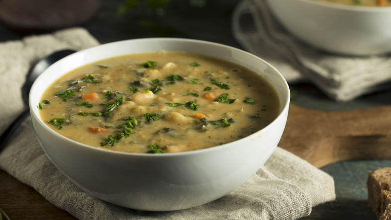 two bowls of soup on rustic table