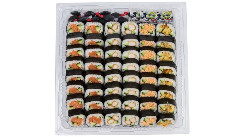 Large square Costco sushi platter with multiple roll types