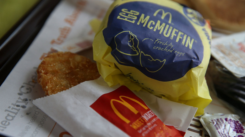 McDonald's Egg McMuffin in packaging and a hash brown