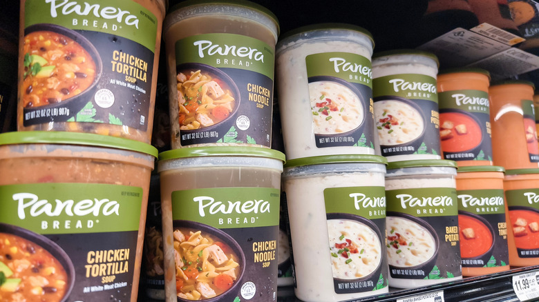 A supermarket shelf stocked with tubs of ready-made Panera soup