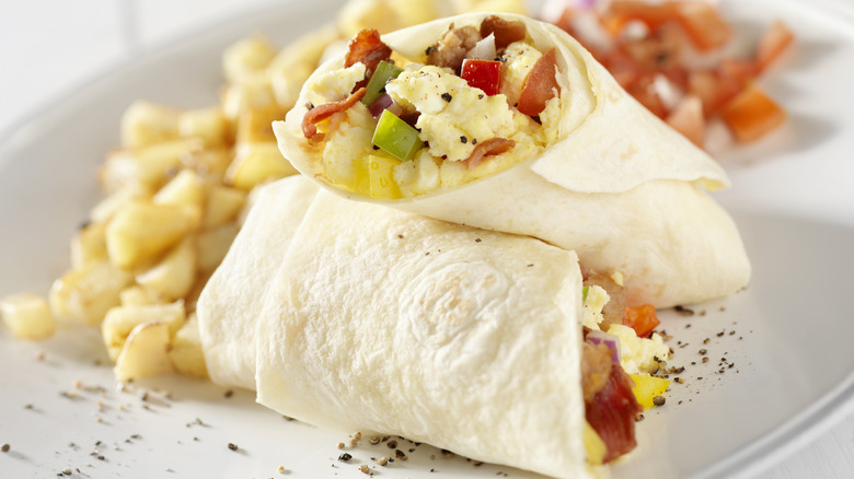 breakfast burrito filled with eggs and peppers