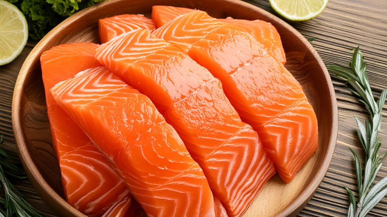 A plate of fresh raw salmon fillets