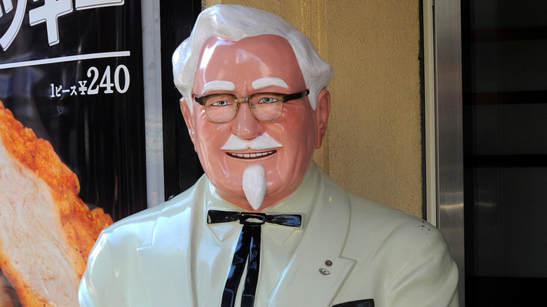 col harlan sanders statue at a kfc in japan