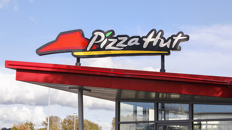 Pizza Hut outdoor sign over awning